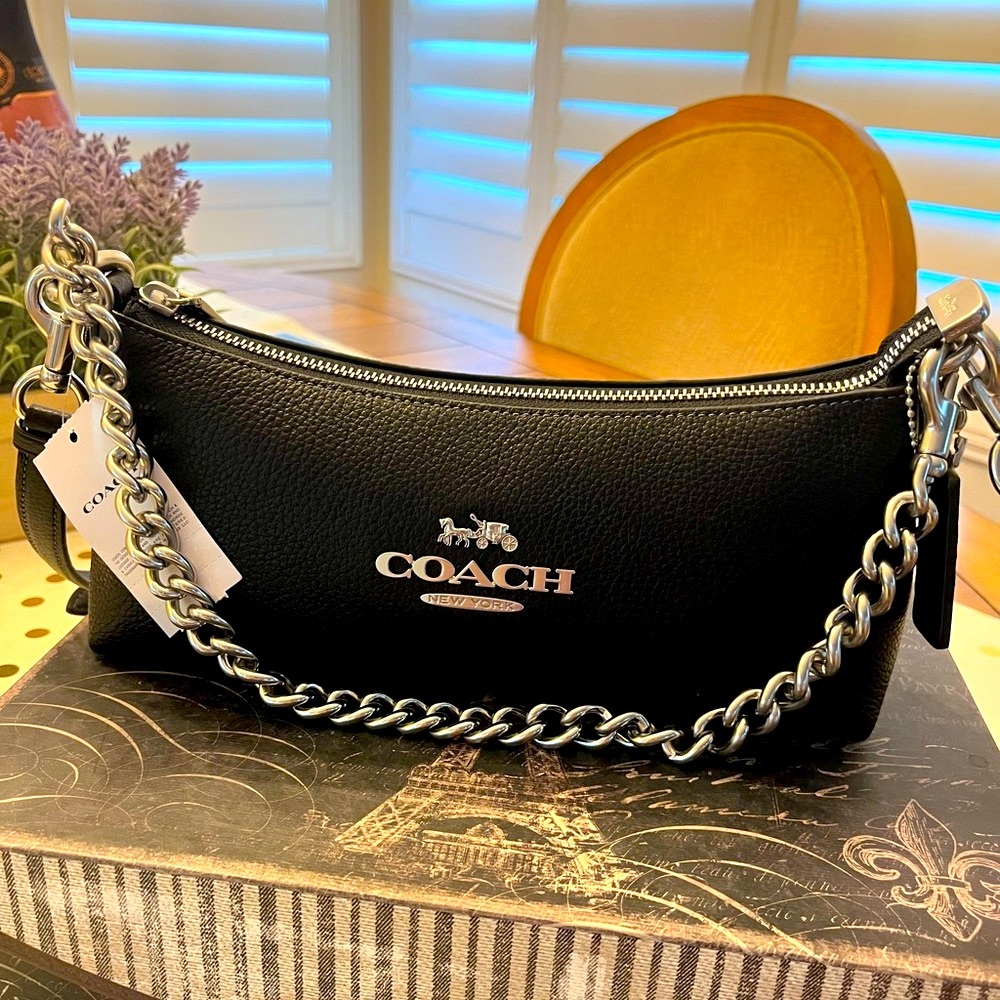 Coach black leather purse with silver accents. Never used with tags.
